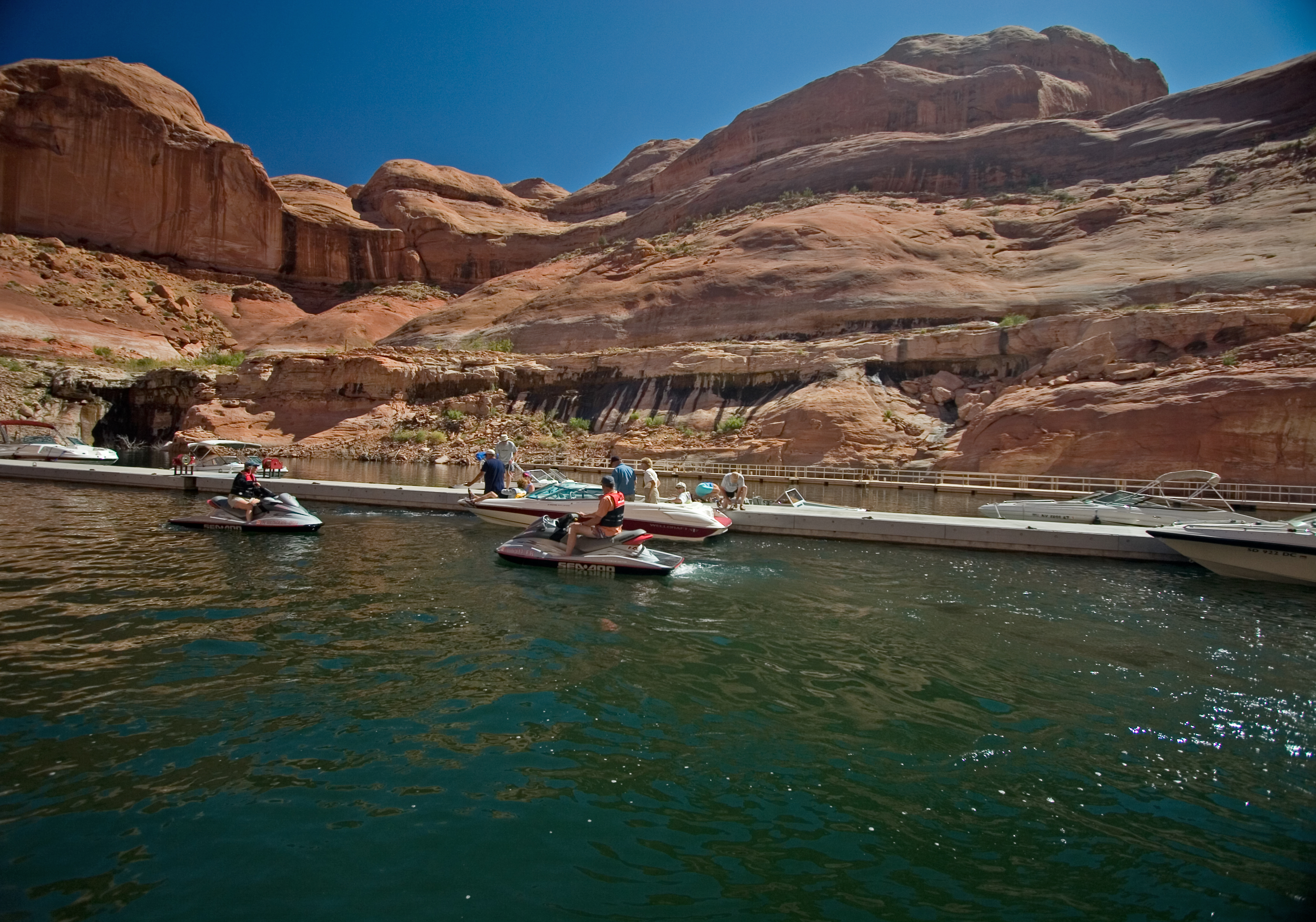 Boats and personal watercraft sidle up to docks.