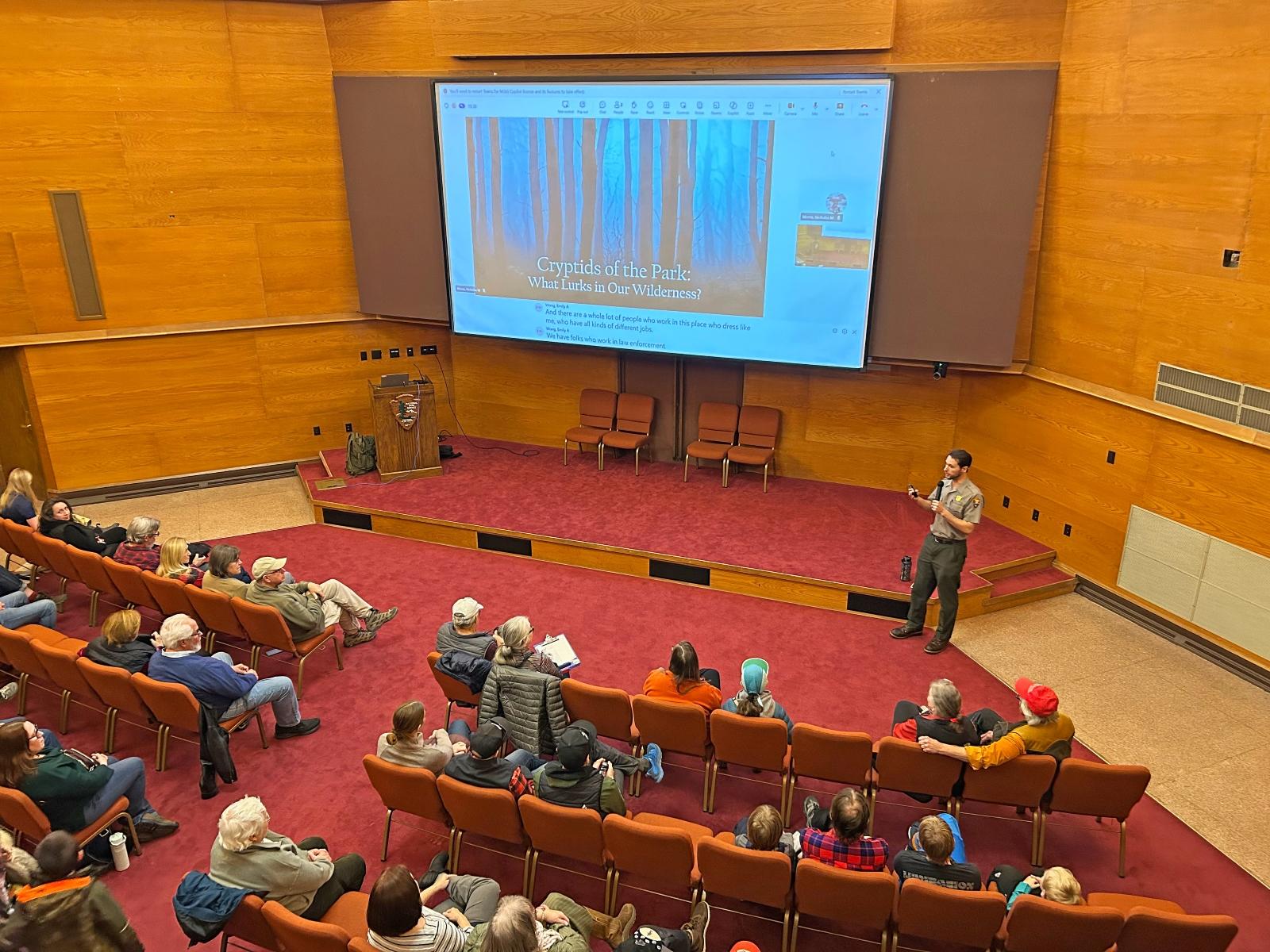 A park ranger is leading a program